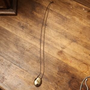 Gold Artisanal Necklace with Intricate Wire Patterns